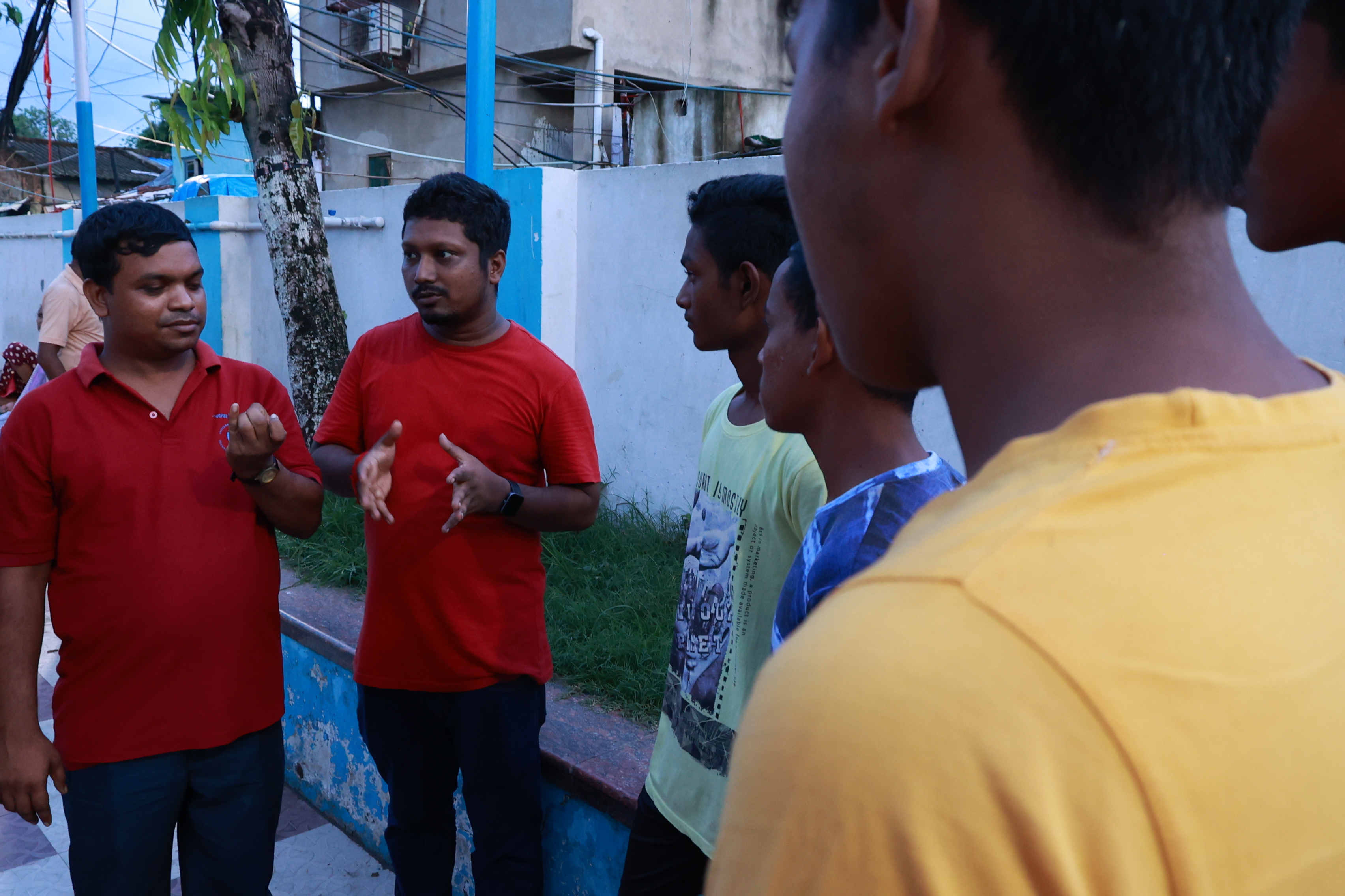 Women participating in a community meeting