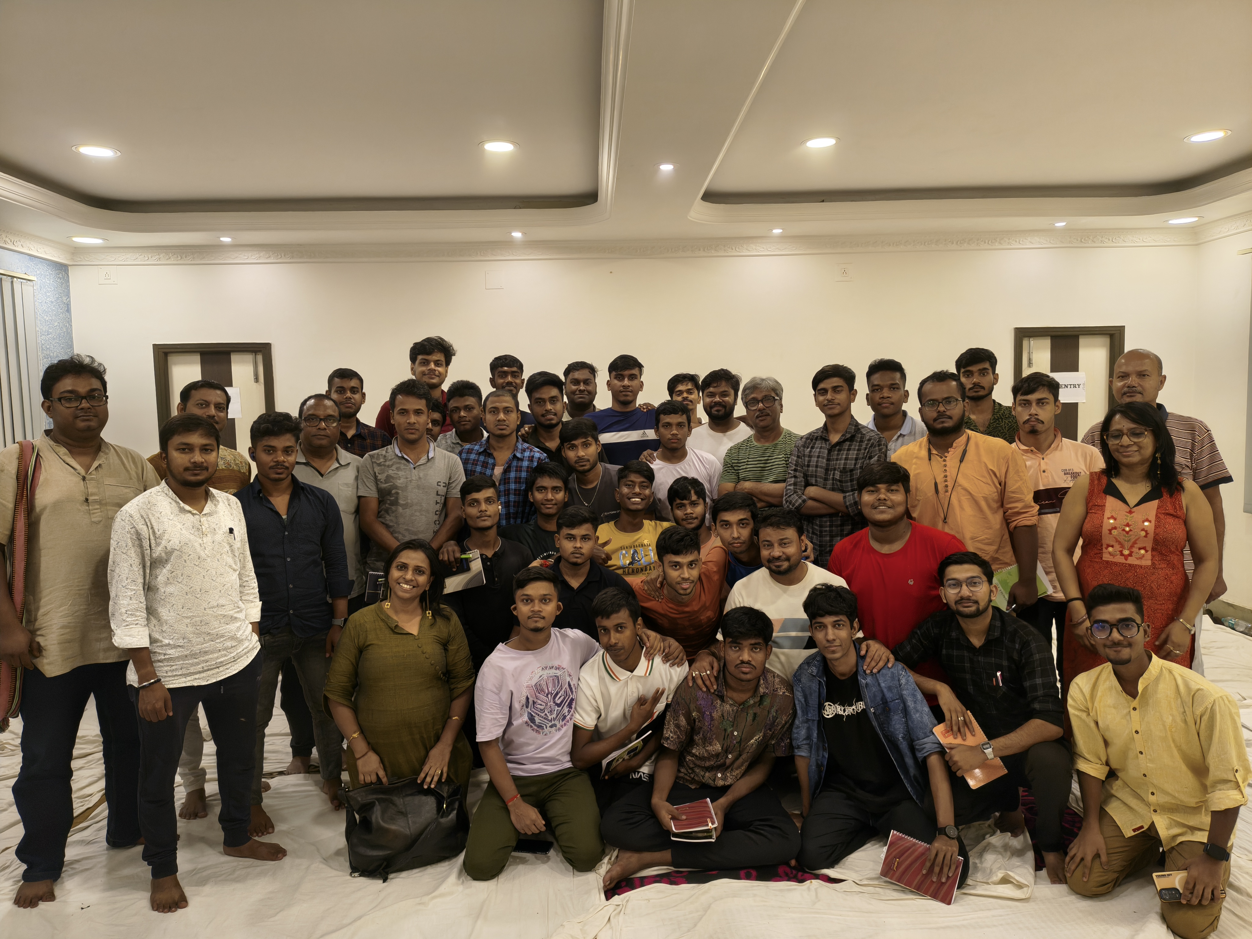 A large group of men and boys gathered after a session