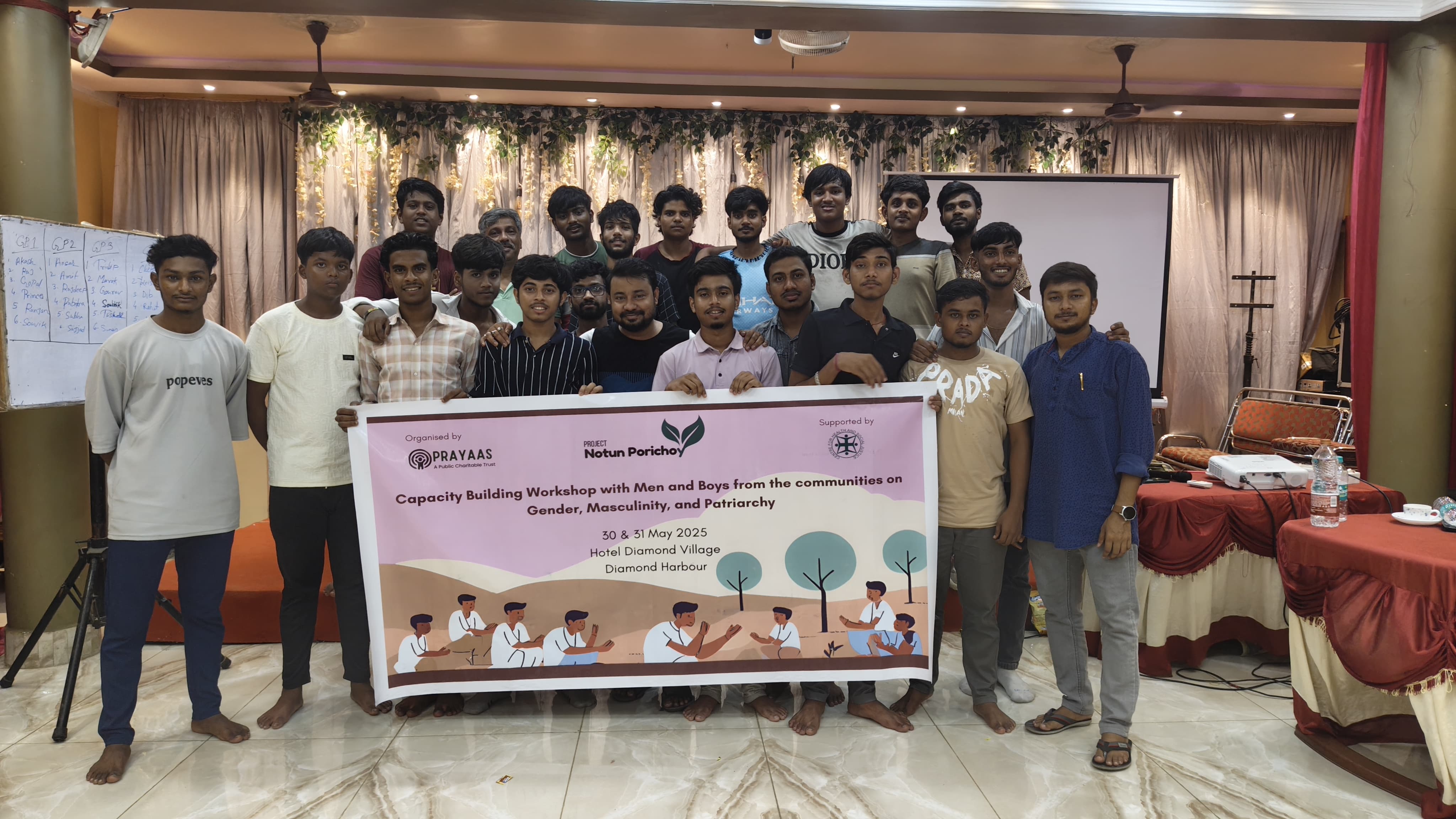 A group of young men in a discussion circle.