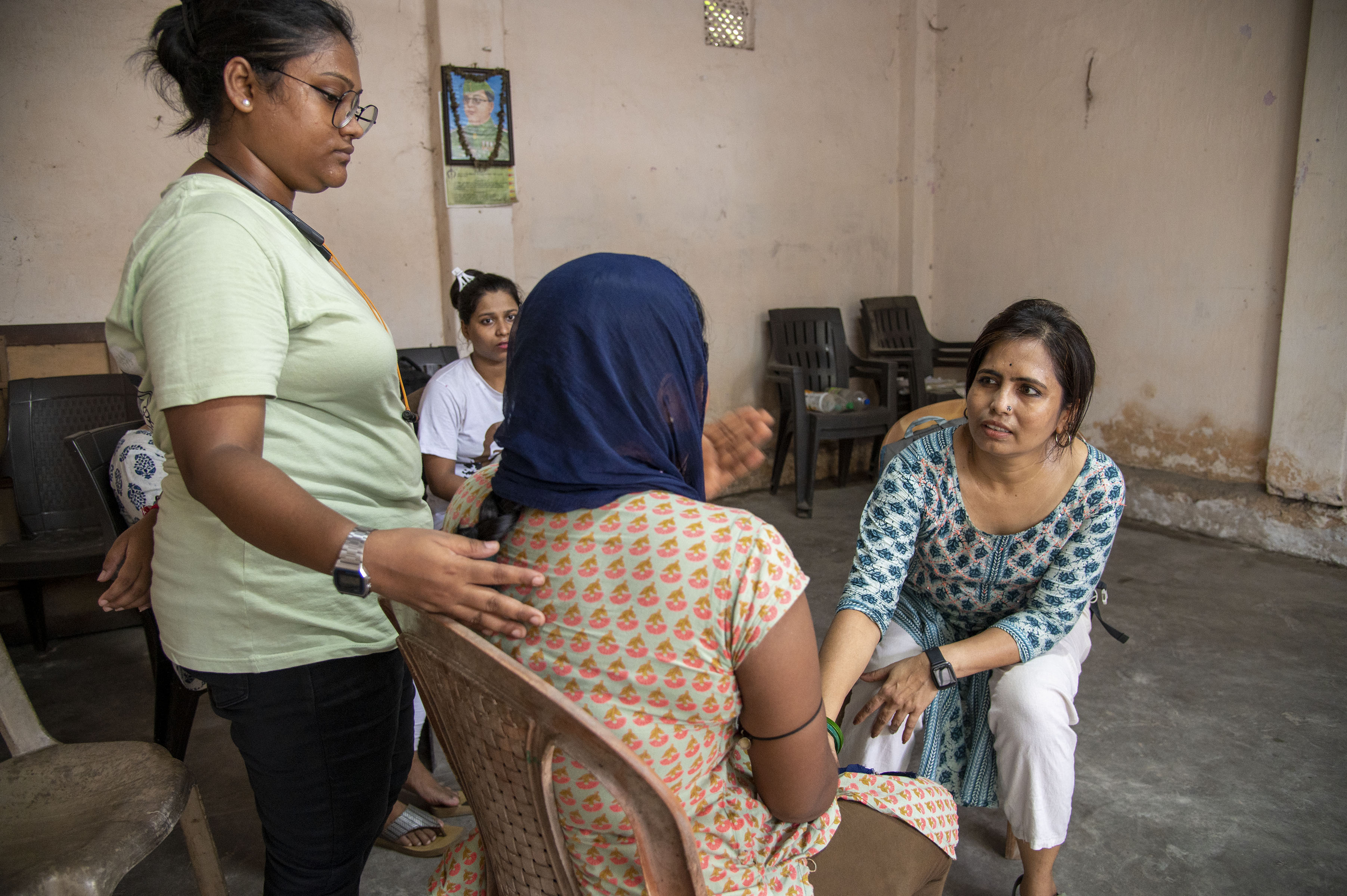 A person signing a legal document, representing legal aid.